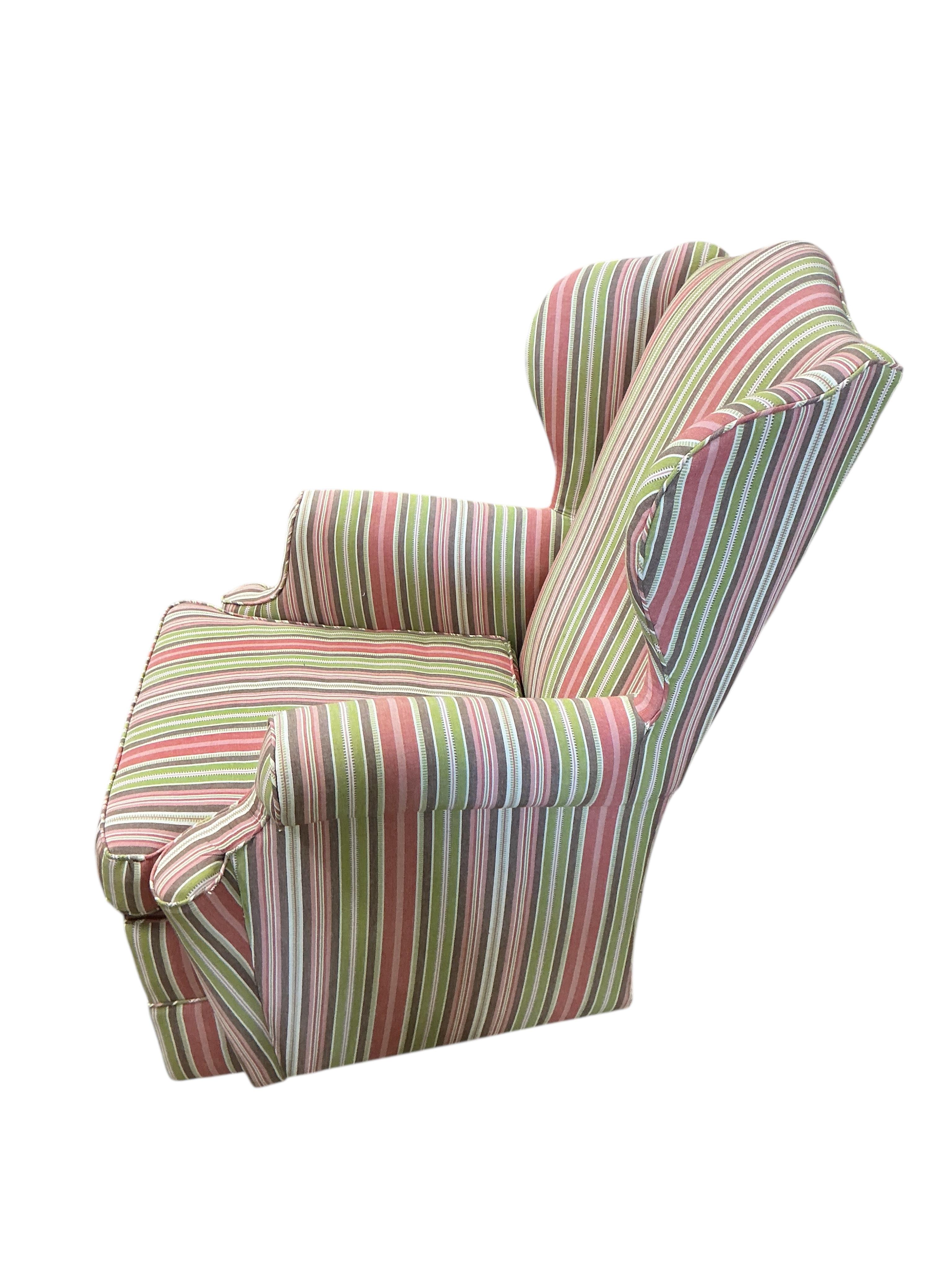 A Victorian style upholstered wing armchair, width 70cm, depth 80cm, height 94cm